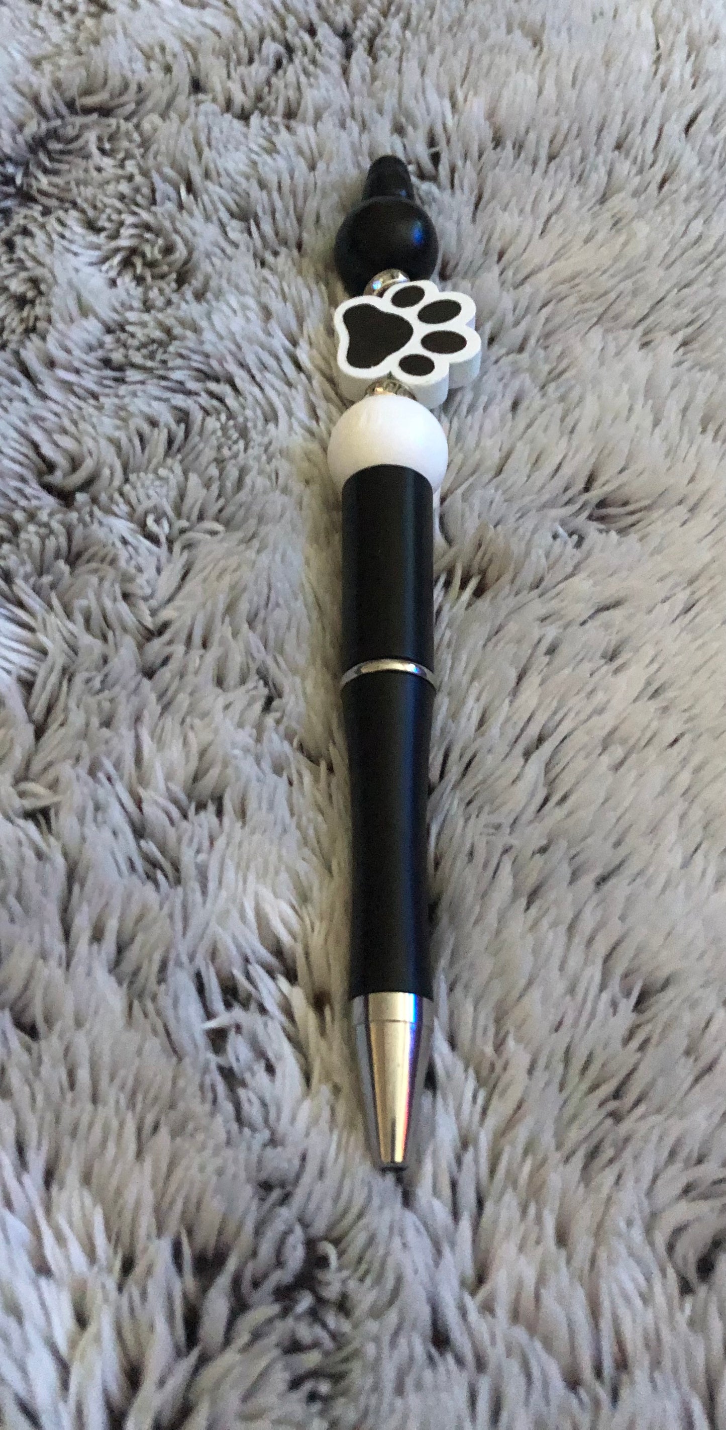 Black and white paw print pen
