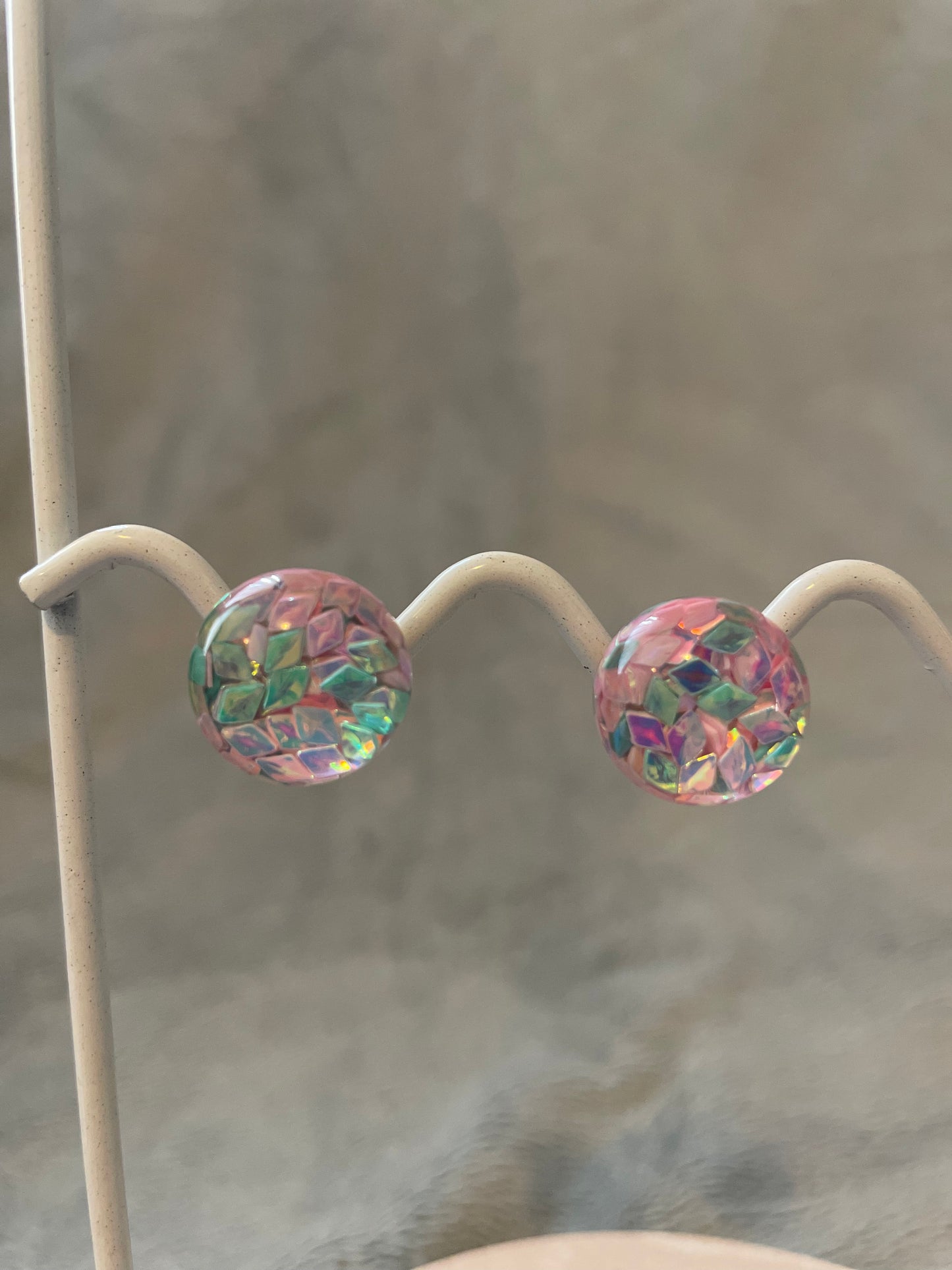 Pink and green round studs
